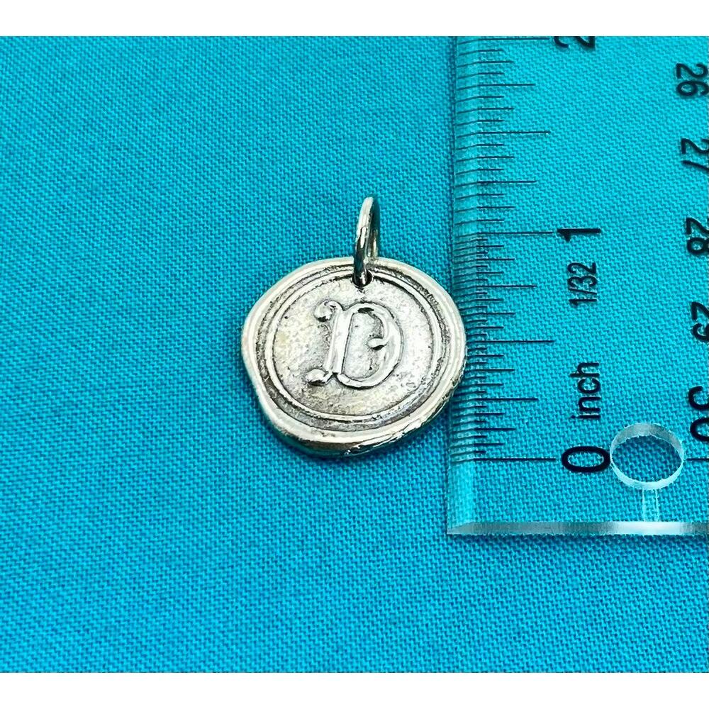 Waxing Poetic Voyager Insignia charm